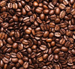 A pile of fresh coffee beans depicting the process of coffee making