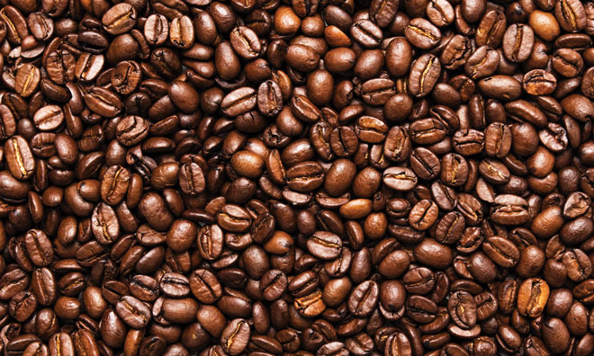A pile of fresh coffee beans depicting the process of coffee making