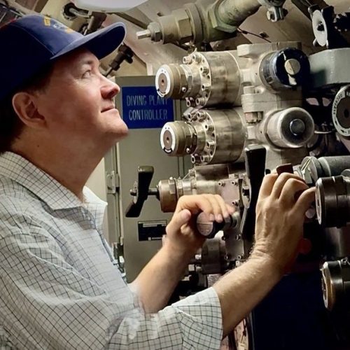 Food safety expert Dr. Darin Detwiler stands aboard the nuclear submarine he served on, connecting his past military service to his present career.