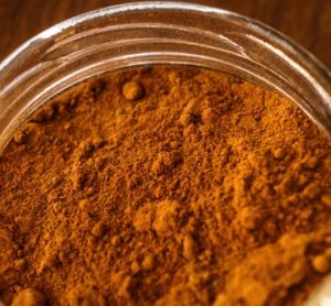 Bowl of ground cinnamon, representing brands affected by the FDA cinnamon recall 2025 due to lead contamination.