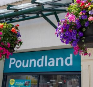 Front view of a Poundland store in the UK, showing its entrance and branded signage.