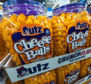 Utz Cheese Balls on store shelves, part of the brand’s portfolio transitioning to FD&C-free products by 2027